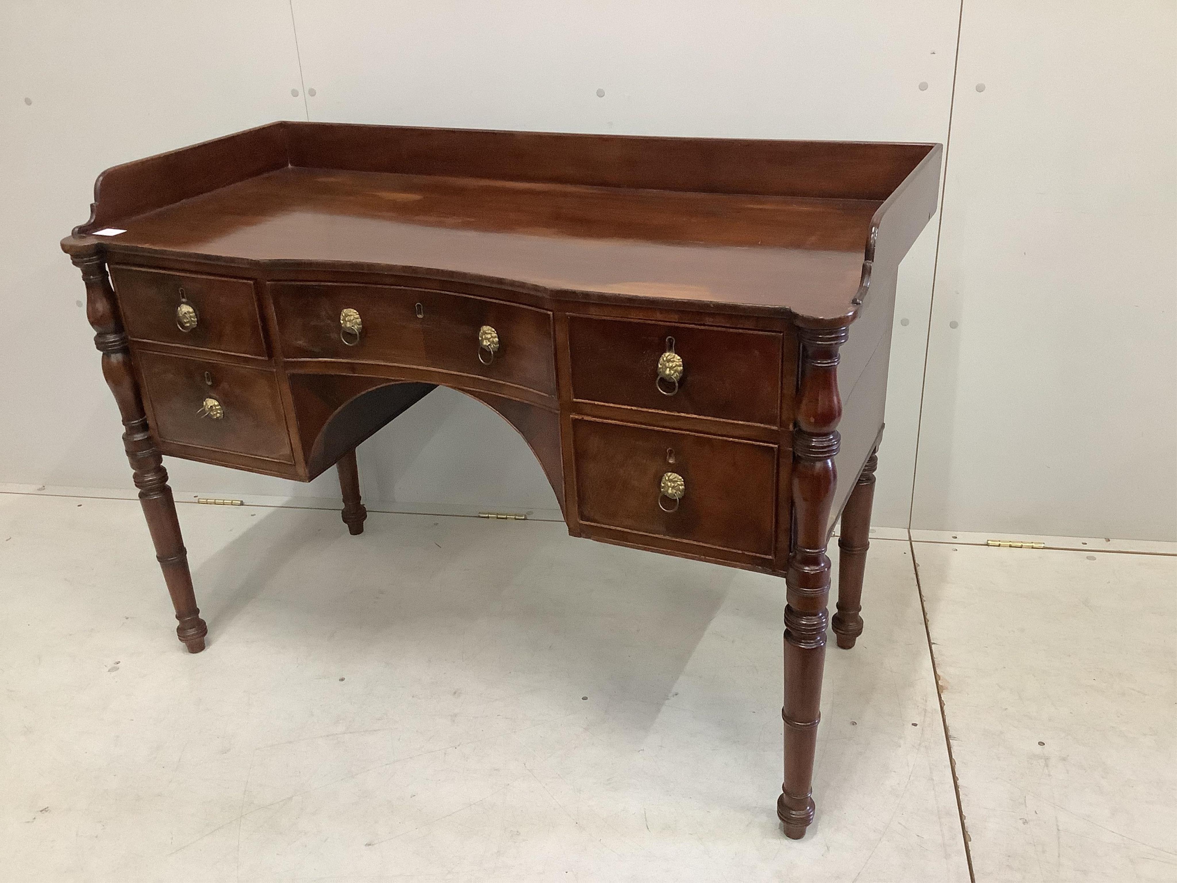A Regency mahogany concave washstand, width 122cm, depth 55cm, height 86cm. Condition - fair
